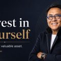 Quote banner reading: 'Invest in Yourself — Your most valuable asset.' with a smiling man in blue glasses on the right.