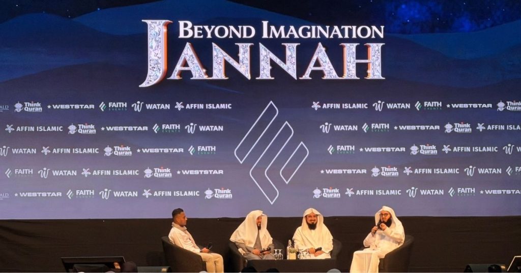 Stage panel discussion at 'Beyond Imagination: Jannah' event, four men in white robes seated on stage with a branded backdrop and logos behind them
