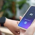 Person holding a smartphone displaying an AI assistant screen with the prompt 'How can I help you?'