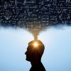Profile silhouette of a person with sunlight shining from the head, surrounded by chalkboard equations, symbolizing ideas and thinking.